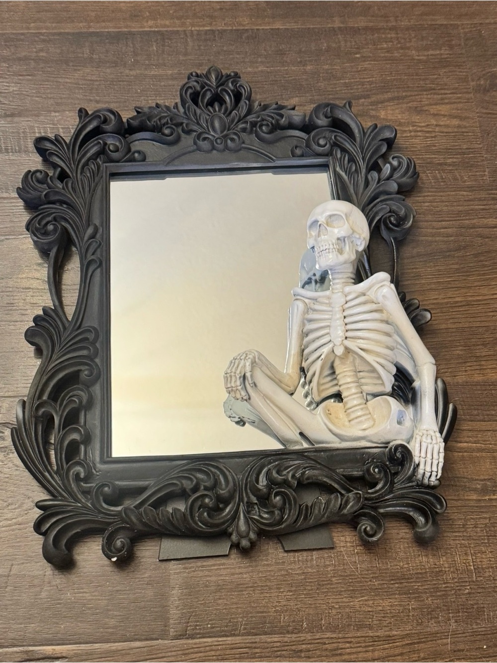 Black Ornate Wall Mirror with Skeleton Accent
